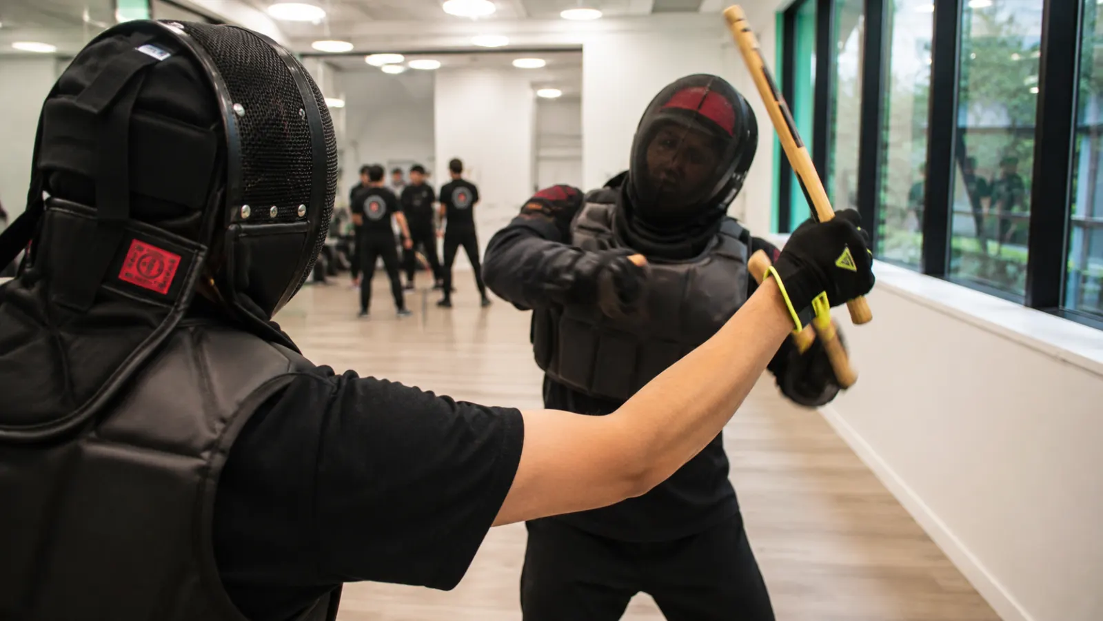 Entraînement Ikemba avec protections et bâtons